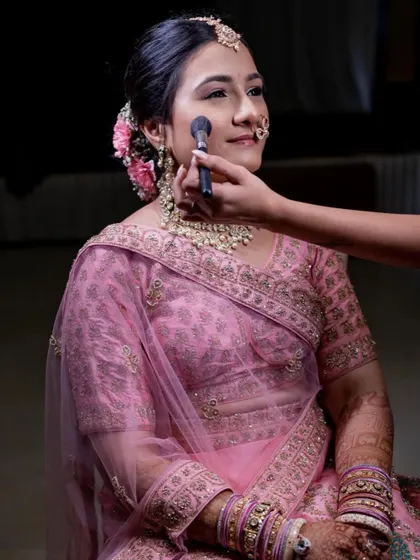 A behind-the-scenes moment of creating this simple and beautiful look. A light touch of blush on the cheeks adds a fresh, healthy pop of color.