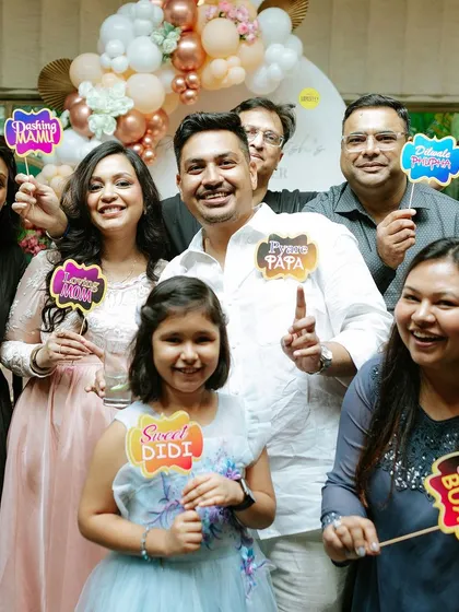 It's a family affair! I love creating fun photo props for everyone, from 'Pyare Papa' and 'Drama Queen Nani' to 'Sweet Didi' and 'Dhakad Bua'. They always bring out the smiles.