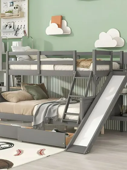 A grey bunk bed that has it all: storage drawers, shelves, and even a slide.