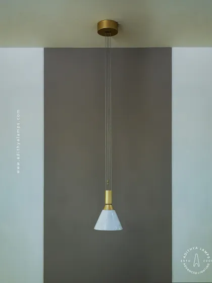 A simple yet elegant cone-shaped pendant light. The shade is crafted from marble, providing a warm, diffused downlight that is perfect for task lighting over kitchen counters, reading nooks, or as accent lighting.