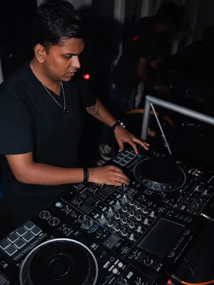 A focused shot while mixing at Grey Cravings. Every track is carefully selected to maintain the party's momentum.