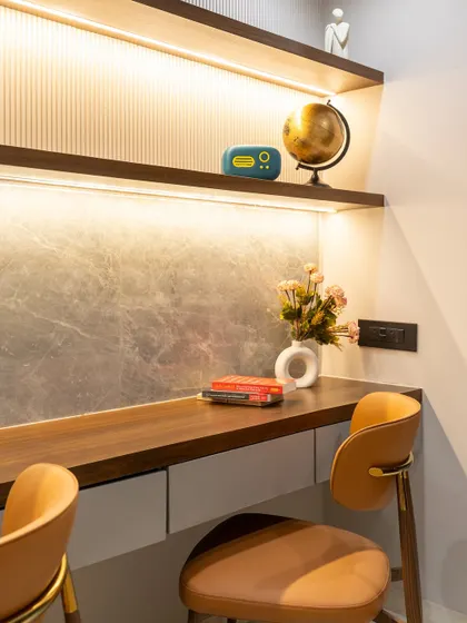 A study space that speaks volumes, not just in style, but in intention. From the rich warmth of the tan chair to the sleek sophistication of HDHMR wall panels, every element is designed to inspire focus while reflecting elegance.