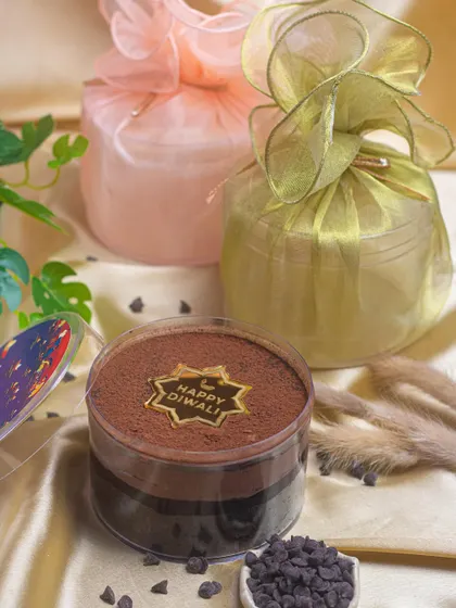 Scoop into the joy of Diwali with my dream cake. This one is a rich chocolate crunch cake, beautifully packaged in organza bags for a luxurious feel.