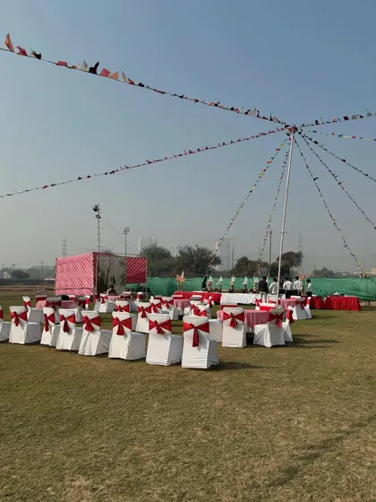 A wide view of the event space, decorated with flags and seating for a large birthday party. My venue can comfortably host groups of all sizes.