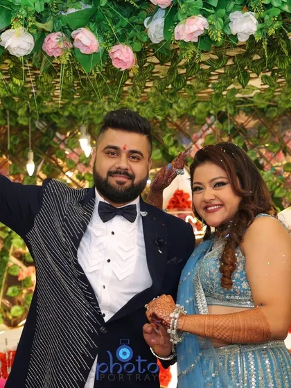 A celebratory pose from a lively ring ceremony. We make sure to capture the energy and happiness of the couple as they celebrate with their guests.
