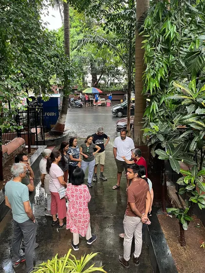 A community walk concluding at Nepean Greens, with participants discussing neighborhood activation and the role of public spaces.