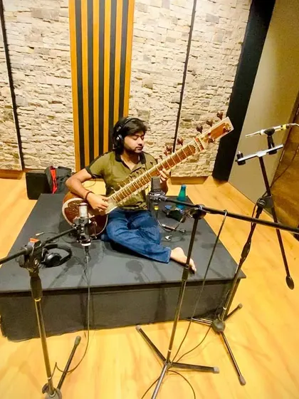 A wider view of the recording setup at TAG Institute. I am seated on a raised platform, a common practice in studios to ensure the best possible sound isolation and acoustics for the instrument.