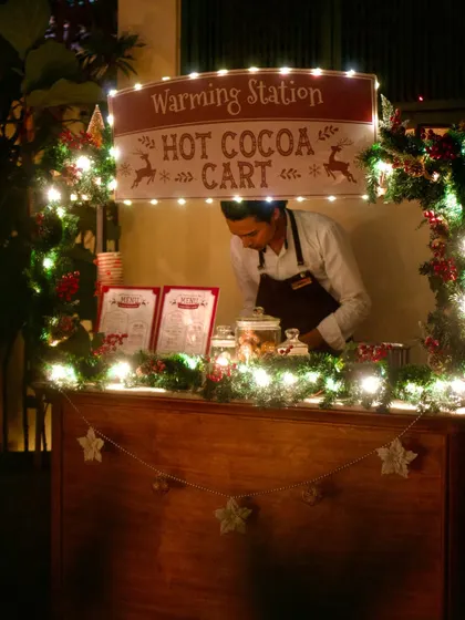The famous Hot Cocoa Cart from our first Christmas. This warming station became a beloved part of the holiday experience, serving countless cups of cheer.