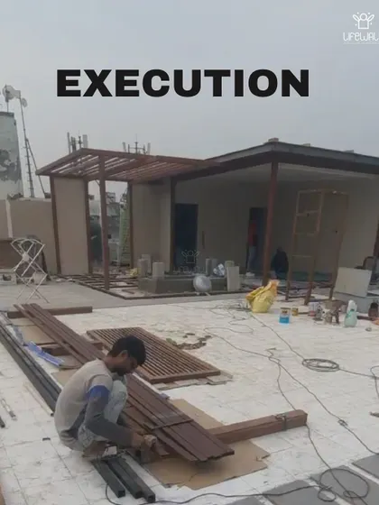 The "Execution" phase of a glass house and pergola project. This photo shows the structures being built and materials being prepared on site.