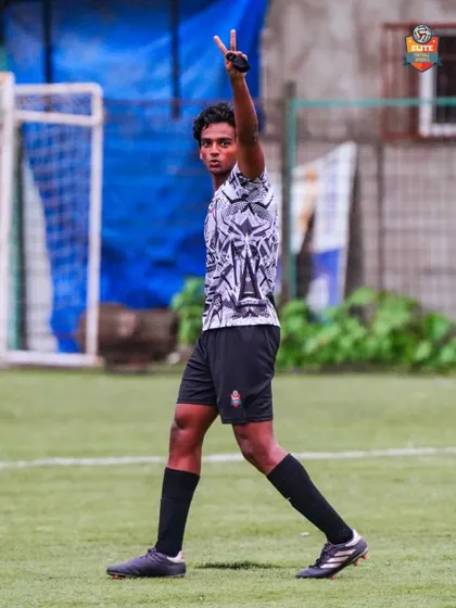 A player celebrating with a peace sign, cool and confident after making an impact on the game.