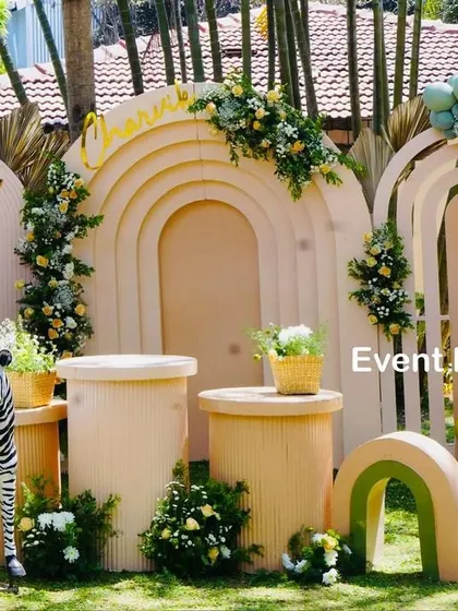 Another angle of Charvik's stylish safari party, showing the arrangement of the ribbed pedestals, animal props, and the elegant balloon garland. The attention to texture and color creates a sophisticated look.