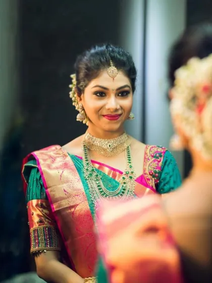 Shrusti in another look for her wedding festivities. A beautiful teal and pink Kanjeevaram saree, showing her versatile bridal style.