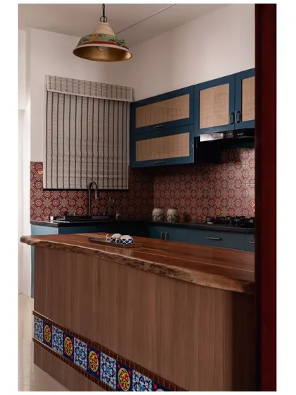A duplicate of image 28, showing the kitchen with its live-edge island.