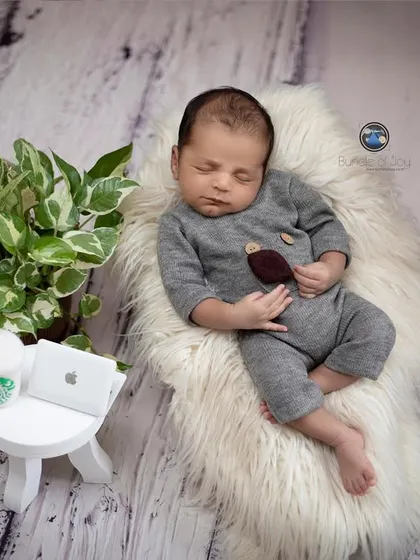 A humorous 'Back to Monday' theme for the modern baby. This little one is all set for a busy day with a tiny laptop, a cup of coffee, and a comfy place to nap.