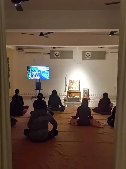 A view from behind the curtain, looking in on the Sangha. There is a beautiful sense of intimacy and shared purpose in these gatherings.