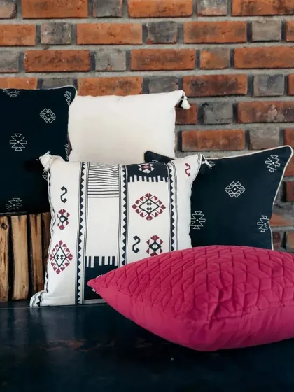 A bold combination of our tribal-inspired monochrome cushions with a pop of vibrant pink. This shows how you can mix our collections to create a unique and personal style.