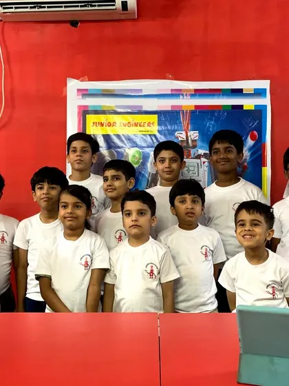 A group photo of our robotics competition participants. We foster a healthy competitive spirit and celebrate the hard work of every student.