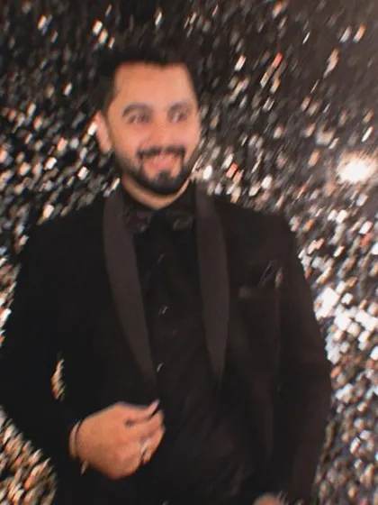 A cool, motion-blur shot against a glittering background, capturing the dynamic energy of a party.