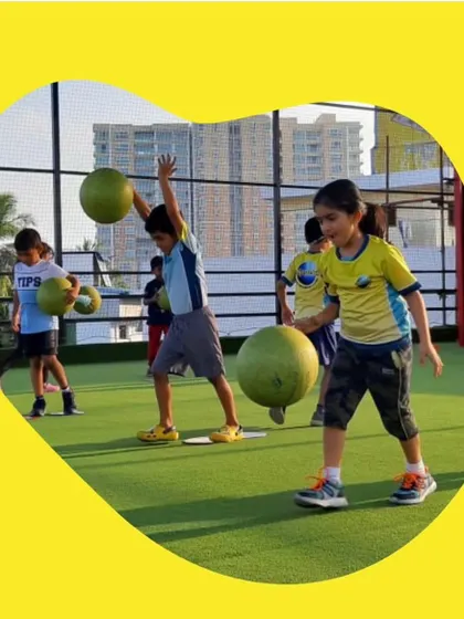 Working with different types of balls helps develop strength and coordination. In this outdoor session, the kids are practicing throwing and catching exercises that build their upper body strength and improve their spatial awareness.