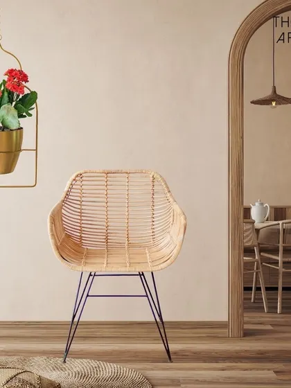 My hanging metal planters are designed to draw the eye upward. This one, with its traditional arch-inspired frame and gold pot, beautifully holds blooming flowers, adding a touch of grace to your home.