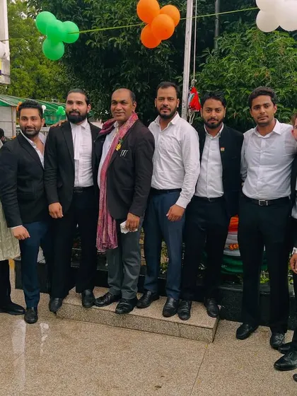 With a group of esteemed colleagues. The legal profession is built on relationships and mutual respect.