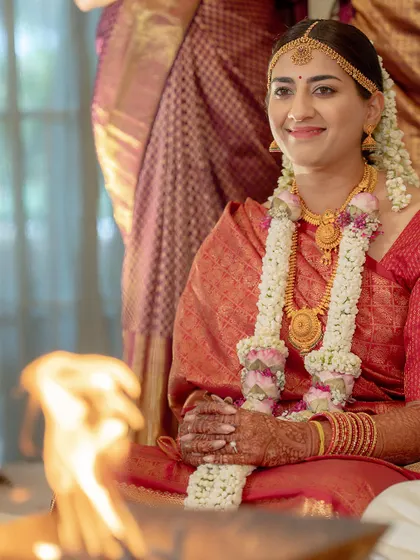 Seated by the sacred fire, this bride looks serene and beautiful. My draping ensures that the saree remains perfectly pleated and comfortable, even when sitting for long periods during traditional wedding rituals.