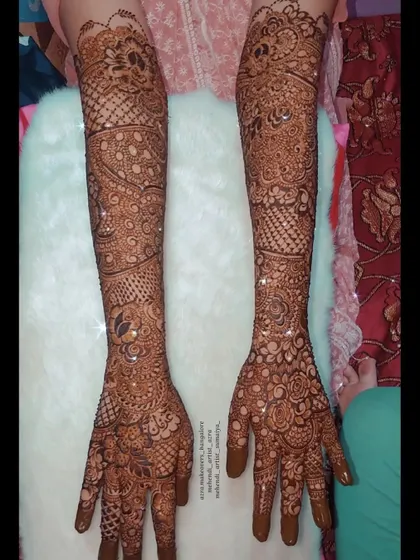 Another view of this intricate bridal mehendi, highlighting the consistency of the pattern across both arms.