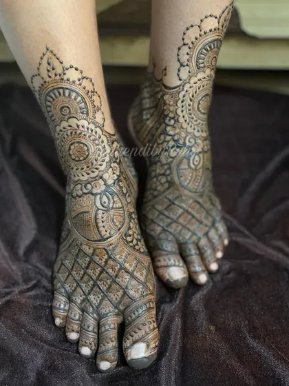 I also offer intricate mehendi for feet, perfect for brides or anyone wanting a complete look. This design features detailed checkerboard patterns and classic mandala work covering the entire foot.