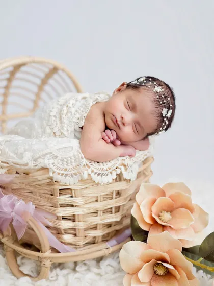A close-up from a different angle, highlighting the delicate star headband and the baby's serene expression.