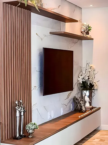 This design combines a white marble back panel with fluted wood accents for a textured, high-contrast look. The floating console and asymmetrical shelves provide a modern and functional storage solution.
