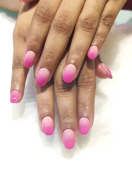 Pink dreams and ombré goals. This is a perfect example of a soft pink gradient, blending from a light, milky pink to a brighter shade at the tips.