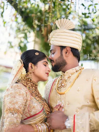 A romantic close-up of the couple. The bride's makeup is soft and timeless, with defined eyes and a neutral lip that lets her natural beauty shine.