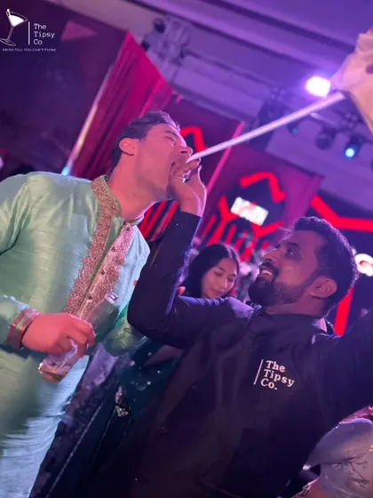 The party doesn't stop at the bar. Our team roams the dance floor with shot dispensers, making sure the energy stays high and the drinks keep flowing.