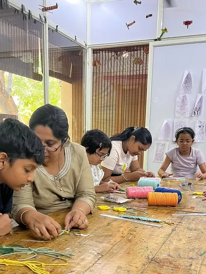 A wide shot of our macrame workshop, where students learn about texture, patterns, and patience. It's a room full of creativity and handmade, heart-made art.