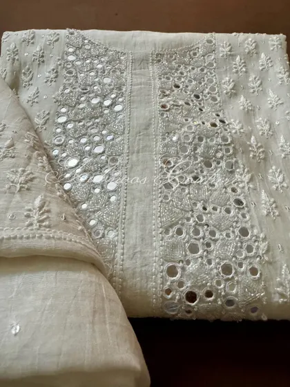A folded view of the kurta, perfect for appreciating the texture and craftsmanship of the mirrorwork.