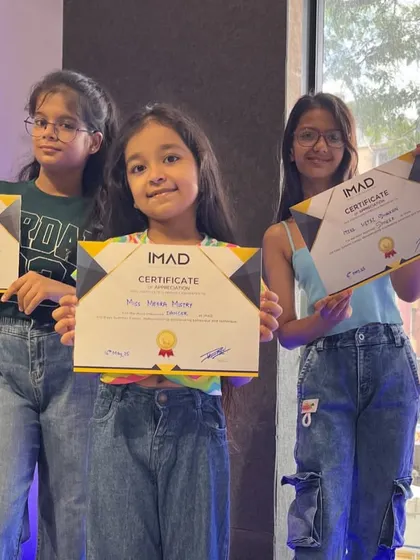 Our teen students proudly displaying their summer camp completion certificates.