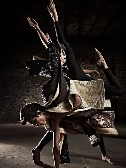 This photo from the "Sway" campaign captures a moment of dynamic balance and connection between two dancers. The movement was designed to showcase the interplay of strength and grace inherent in the collection.