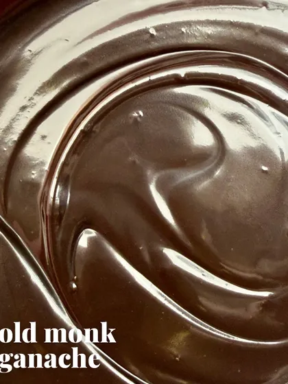 The final touch is our secret weapon: a ganache made with rich dark chocolate and a generous splash of Old Monk rum. It adds that boozy, complex finish.