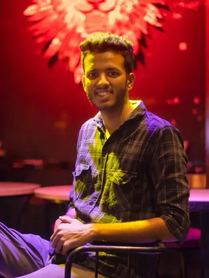 A portrait of me at a club shoot location. I'm comfortable shooting in all kinds of lighting conditions, from bright daylight to moody indoor venues.