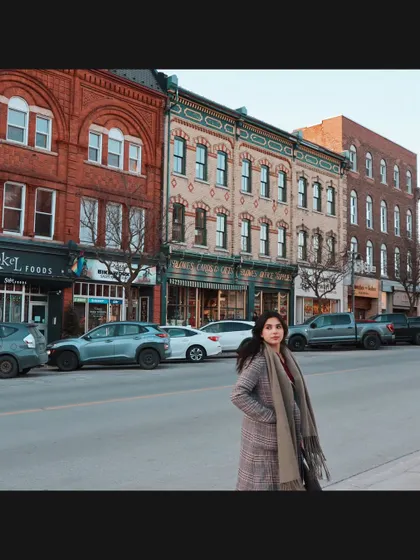 Showcasing my winter street style against the charming storefronts of downtown Stratford.