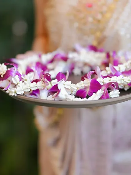 A tray of beautiful floral garlands ready to welcome guests in traditional Thai style.