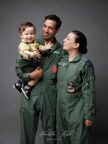 A candid moment during the Airforce family's photoshoot. The genuine interaction and laughter between them make this portrait extra special.