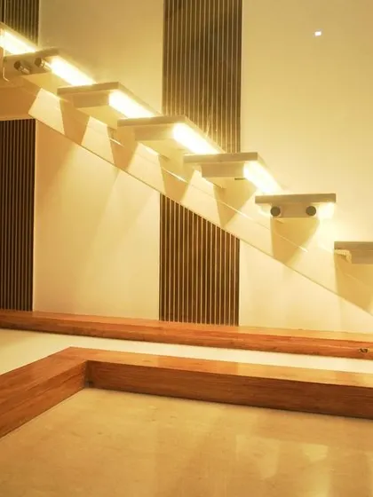 A detailed shot of the illuminated staircase, showing how lighting can be used to create a dramatic and beautiful architectural feature.