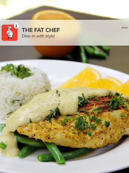 It's all about the fusion. This dish of grilled chicken in a creamy sauce with rice and beans is a perfect example of our global culinary approach.