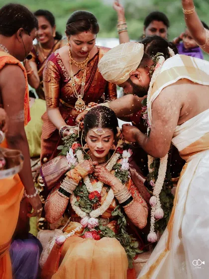 A key moment from a South Indian wedding, the 'jeerige bella' ritual, captured with beautiful emotion.