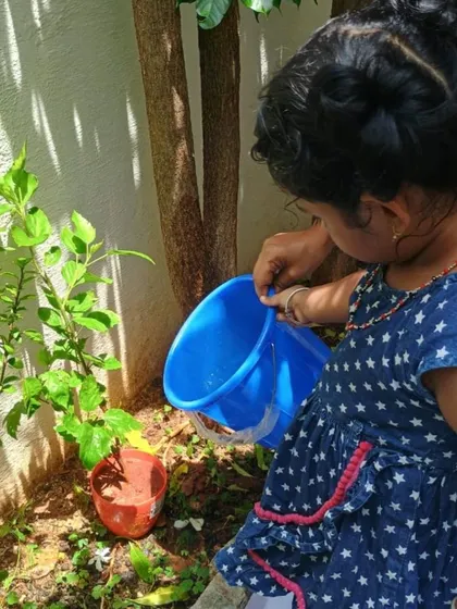 Another little helper watering the plants on Environment Day.