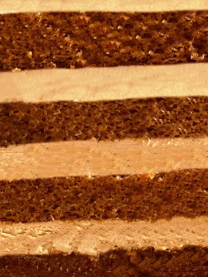A close-up of the layers inside my Caramel Cake. The alternating light sponge and creamy caramel-infused buttercream create a beautiful striped effect.