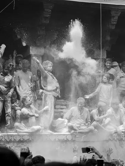 A black and white photo series from Masaan Holi. These images strip away color to focus on the raw emotion, the crowds, and the stark spiritual power of this unique festival.
