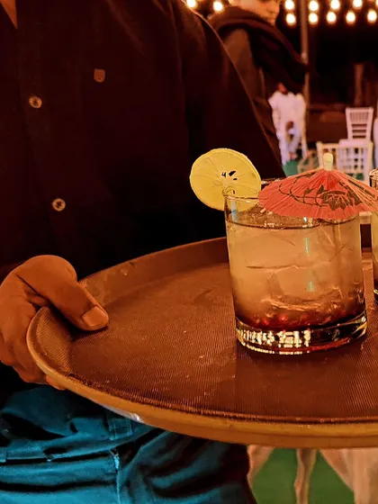 Every drink is served with style. A tray of expertly garnished cocktails ready to be delivered to guests, showcasing our attention to presentation and service.