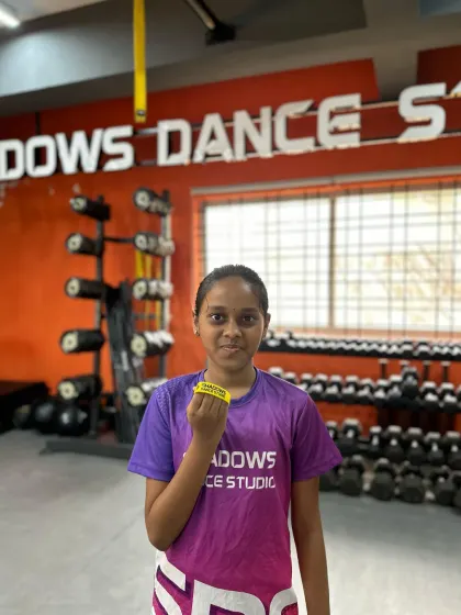 Samruddhi shows off her new yellow band after a brilliant performance in her intermediate level assessment. Congratulations.